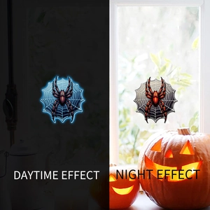 Luminous Halloween spider window stickers showing glowing blue effect in the dark