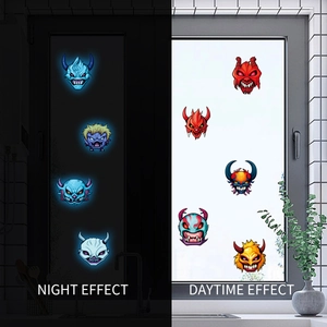 Luminous Halloween monster stickers showing day and night glow effects on glass window