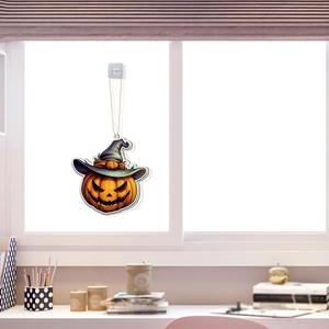 Detail of Halloween pumpkin ornament with witch hat and suction cup for window decor