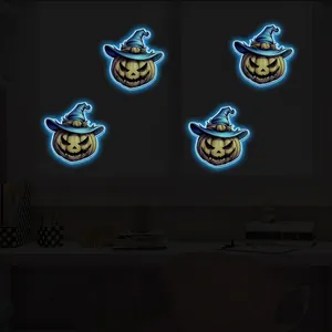 Luminous Halloween pumpkin wall stickers with wizard hats glowing blue in a dark room