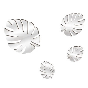 Macro detail of silver mirror acrylic monstera leaf wall stickers with reflective finish