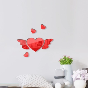 Detail of red acrylic heart mirror wall stickers with reflective finish for home decor