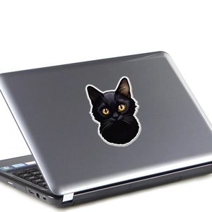 Realistic black cat sticker with yellow eyes on a dark laptop lid for room decor