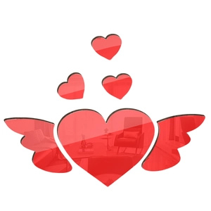 Macro detail of red 3D acrylic mirror wall stickers with heart and wings design