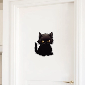 Cute black cat wall sticker with yellow eyes for home decor on a white wooden door