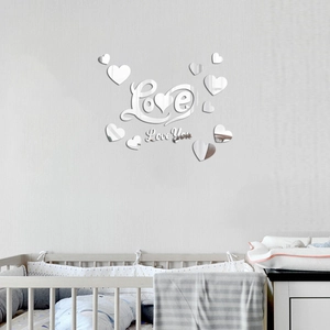 Silver mirror acrylic wall stickers with Love You text and heart shapes in a nursery setting