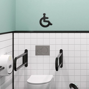 Black 3D accessible wheelchair sign for restroom wall decoration in modern bathroom