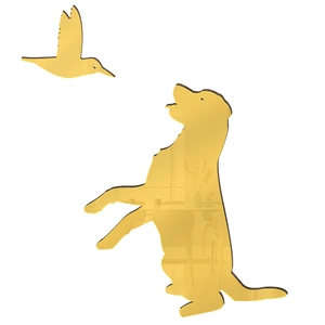 Close-up of golden mirror dog and bird wall stickers with polished reflective surface