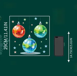 Size comparison of Christmas ball stickers measuring 29cm alongside a 14.75cm smartphone