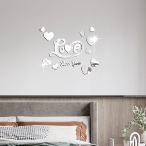 Detailed view of silver mirrored acrylic Love wall stickers with decorative heart patterns
