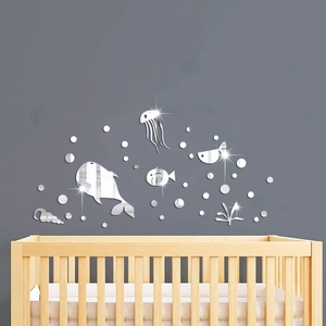 Ocean theme mirrored acrylic wall decals featuring silver whales and fish in nursery