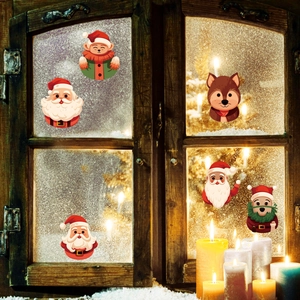 Cartoon Santa Claus and reindeer window stickers on a cozy frosted rustic wooden window