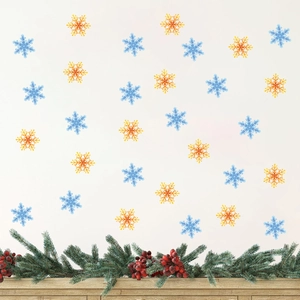 Christmas snowflake wall decals in blue and gold colors on white wall for holiday decor