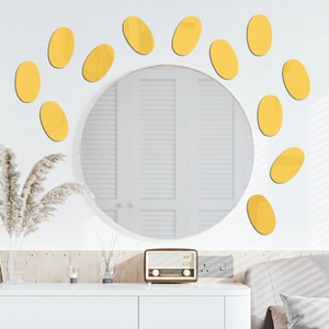 Detail of 12 yellow oval acrylic mirror wall stickers arranged in a sunburst pattern