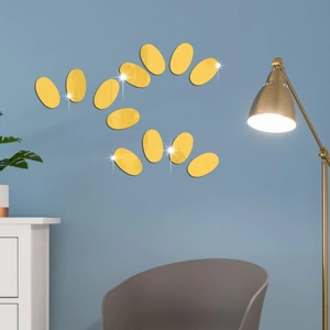 Detailed close-up of 12 gold oval mirror wall stickers arranged on a blue background