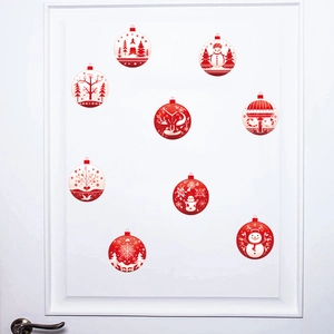 Christmas wall stickers set featuring red and white ball ornaments on white wooden door