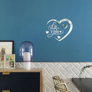 Detail of 3D acrylic heart mirror wall sticker with I Love You lettering on blue wall