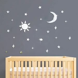 Detailed close-up of silver mirror acrylic sun and moon 3D wall stickers in nursery room