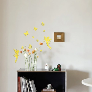 Detail of yellow mirror acrylic wall stickers showing fairy and butterfly designs