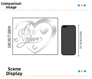 Size comparison of 18cm mirror acrylic heart wall sticker with a smartphone