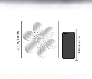 Comparaison de taille du sticker mural fleur miroir de 20cm à côté d'un smartphone