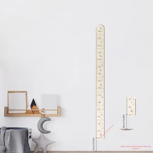 Detail of Nordic wooden growth chart showing the 50cm to 200cm measuring scale on a wall