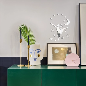 Silver mirror acrylic wall stickers set featuring a ballet dancer, moon, and stars on gray wall