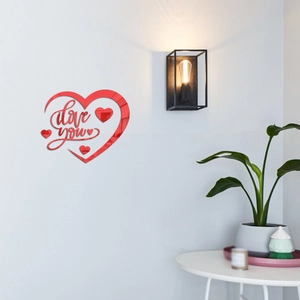 Detailed view of red 3D mirror heart wall sticker with I Love You lettering on white wall