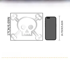 Size comparison of 17cm skull wall sticker next to a 14.75cm mobile phone