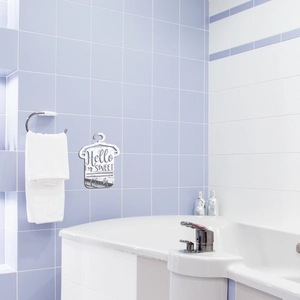Close-up of silver mirror acrylic wall sticker with Hello SWEET Cheeks text for bathroom