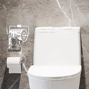 Mirror acrylic wall decor with Wipe Your Butt text above a toilet on marble wall