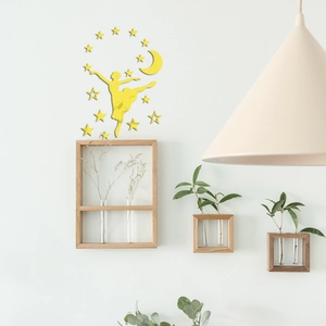 Detail of yellow acrylic mirror wall stickers featuring ballerina, stars, and moon decor