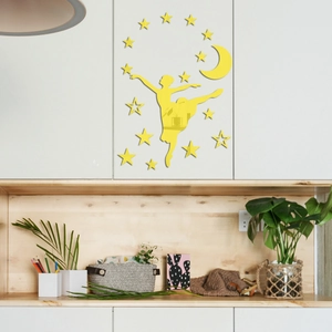 Detail of yellow acrylic mirror wall stickers with ballerina, stars, and moon on a cabinet