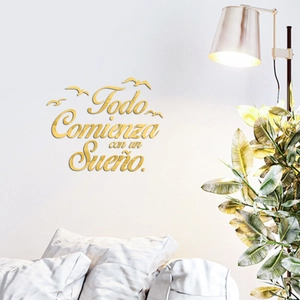 Detail of 3D gold acrylic wall sticker featuring Spanish quote with bird silhouettes