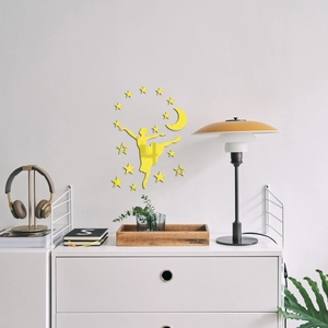 Detail view of gold acrylic mirror wall stickers featuring a ballet girl, moon, and stars