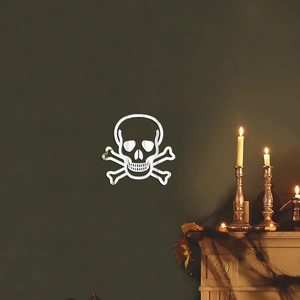 Silver mirror acrylic skull wall decal for Halloween party decoration on a green wall