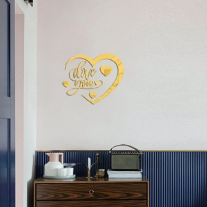 Golden mirror acrylic heart wall sticker with I Love You lettering on grey wall decor