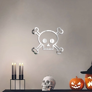 Mirror acrylic skull and crossbones wall sticker set in a Halloween scene with props