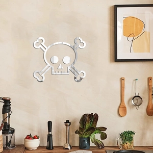 Macro detail of silver acrylic skull wall sticker with reflective mirror finish in a kitchen