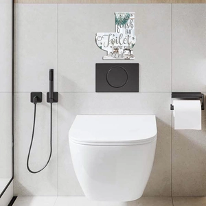 Modern acrylic toilet sign featuring Flush THE Toilet text and green plants decoration