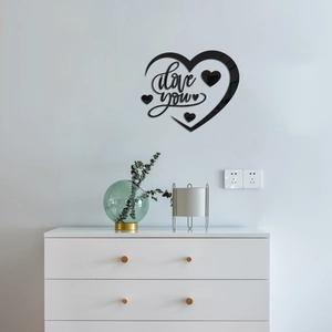 Detail showing glossy black heart-shaped acrylic wall sticker with I love you text