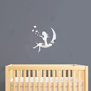 Detail of silver acrylic mirror wall sticker showing girl on moon and heart pieces