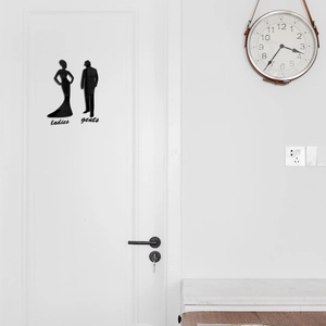 Modern black acrylic bathroom signs with ladies and gents silhouettes on white door