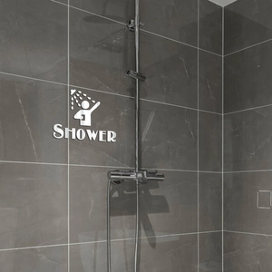 3D acrylic mirror shower wall decal with shower icon and lettering on bathroom tile