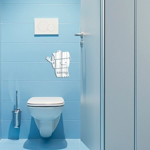 Detailed view of silver acrylic 3D wall sticker with a smiling toilet paper roll design