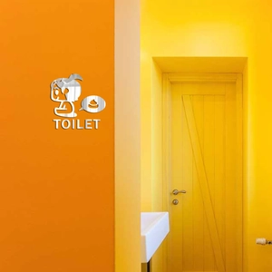 Macro detail of a 1mm acrylic mirror wall sticker with a cartoon figure and TOILET text