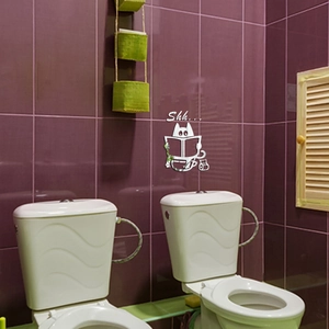 3D silver acrylic mirror wall sticker featuring a cute cat reading a newspaper on a wall