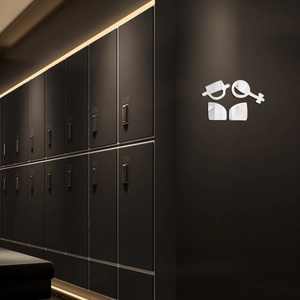 Modern acrylic mirror bathroom signs with sleek geometric design on a dark wall background
