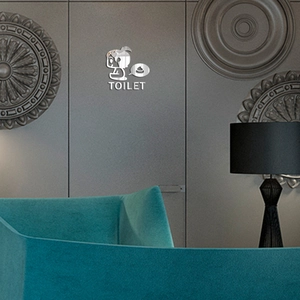 Detail view of silver mirror acrylic toilet sign with creative TOILET lettering for wall