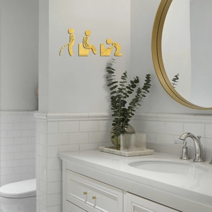 Golden mirror acrylic 3D wall stickers with humorous bathroom figures on a white tiled wall